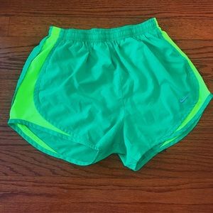 light green Nike running shorts